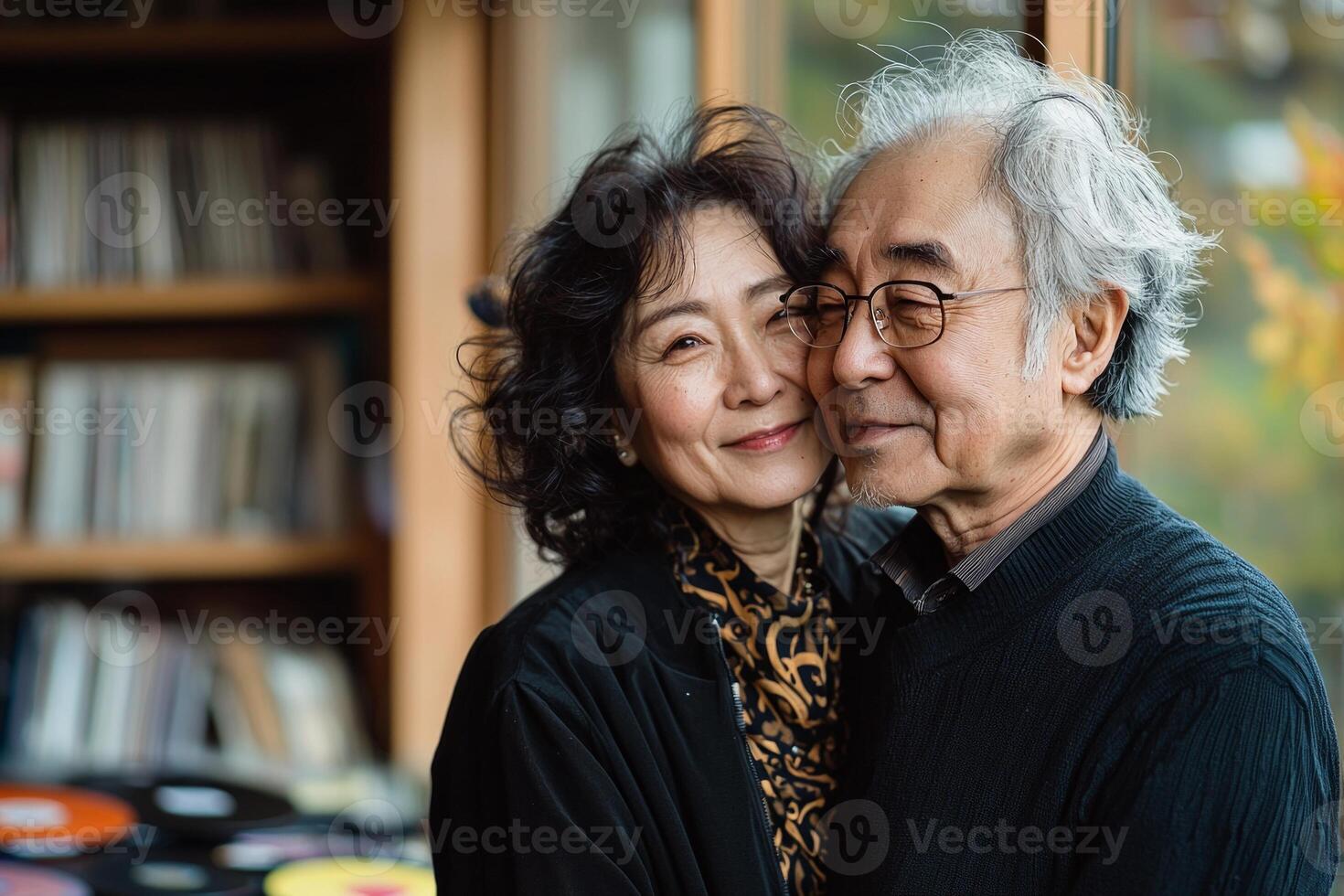 Couple enjoys joyful dance in their warm living room. Late afternoon light illuminates space music records scattered on floor creating candid and intimate atmosphere photo