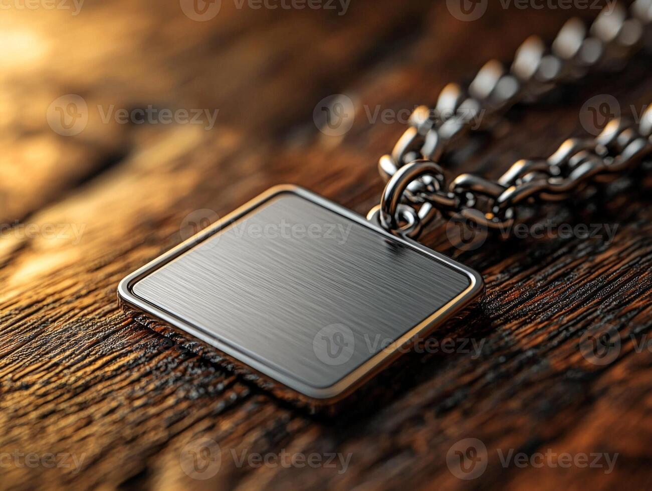 Close up shot reveals keychain featuring flat design and blank engraving area. It elegantly rests on polished wooden surface showcasing its sleek finish photo