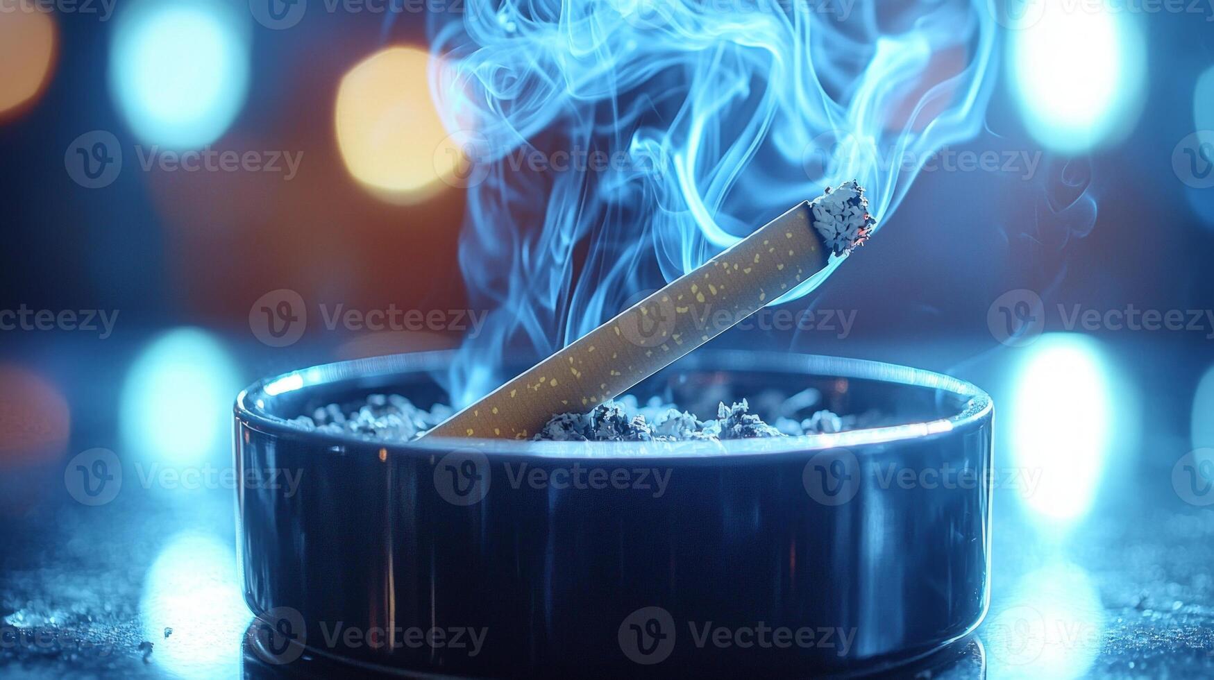 cigarette burns slowly releasing smoke intertwines into skull shape above sleek black ashtray. scene powerfully highlights dangers of smoking's harmful effects photo