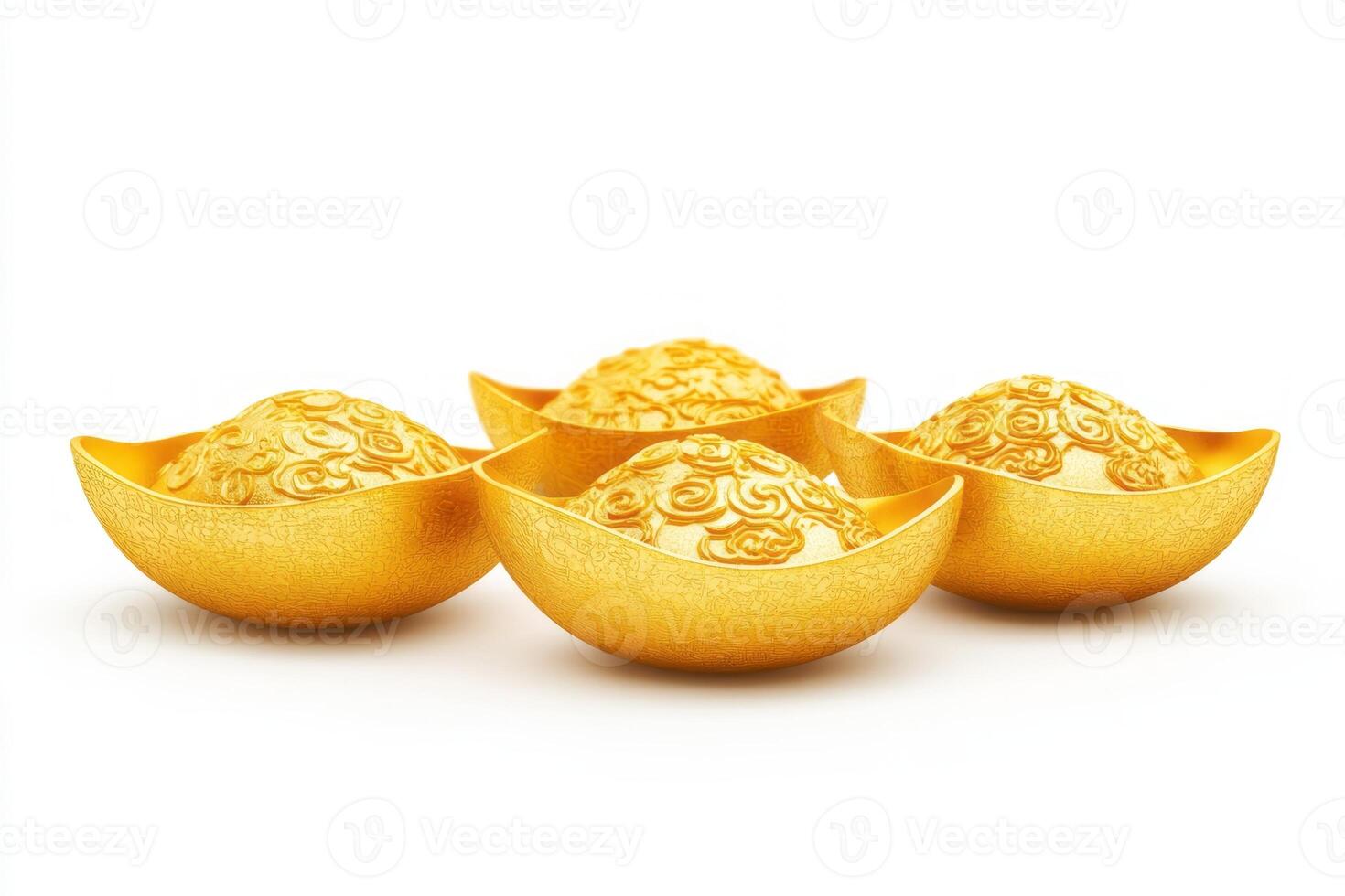 Four ornate golden ingots arranged elegantly, symbolizing wealth and prosperity. photo
