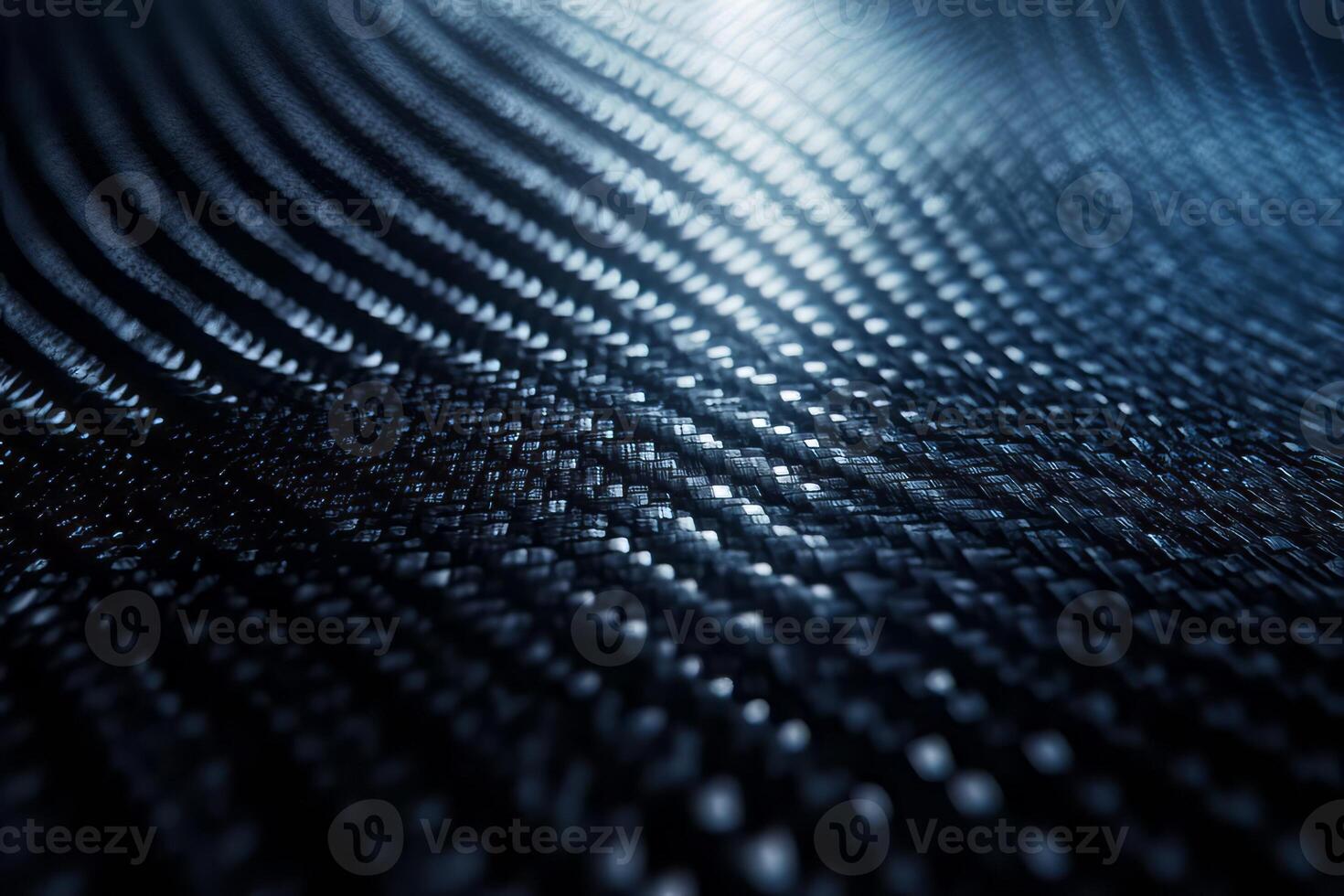 Abstract close-up of a textured surface in dark tones, showcasing intricate patterns and light reflections. photo