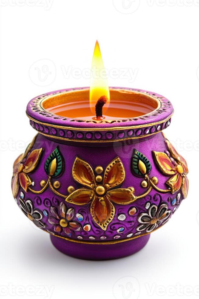 A beautiful handcrafted purple candle with intricate floral designs, glowing warmly with a flickering flame. photo