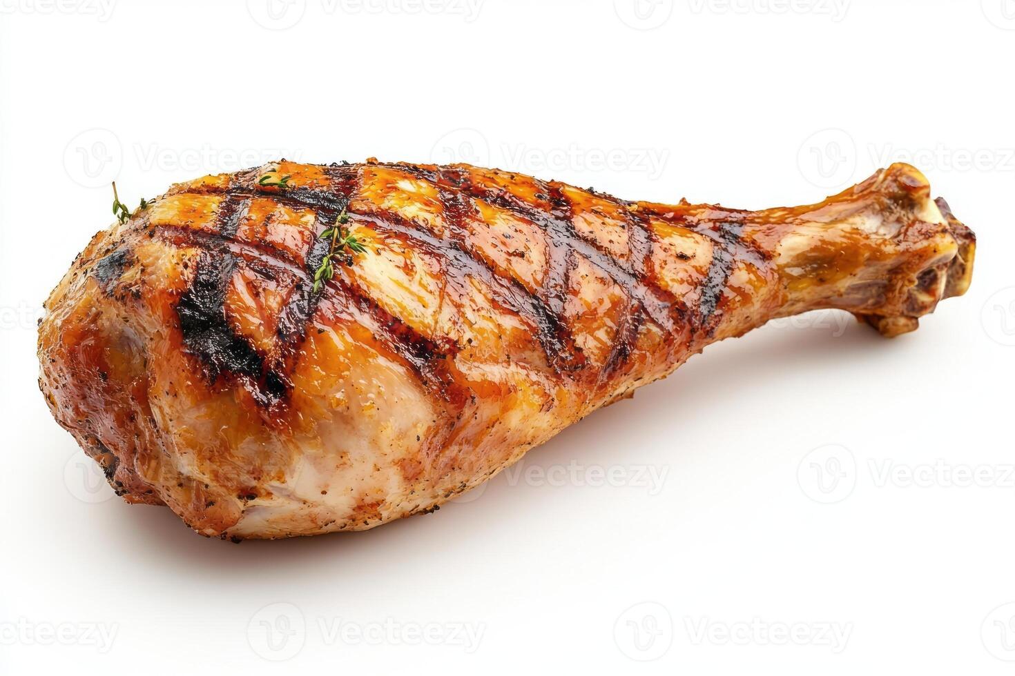 Juicy grilled chicken leg with a crispy exterior and grilling marks, garnished with fresh thyme. photo