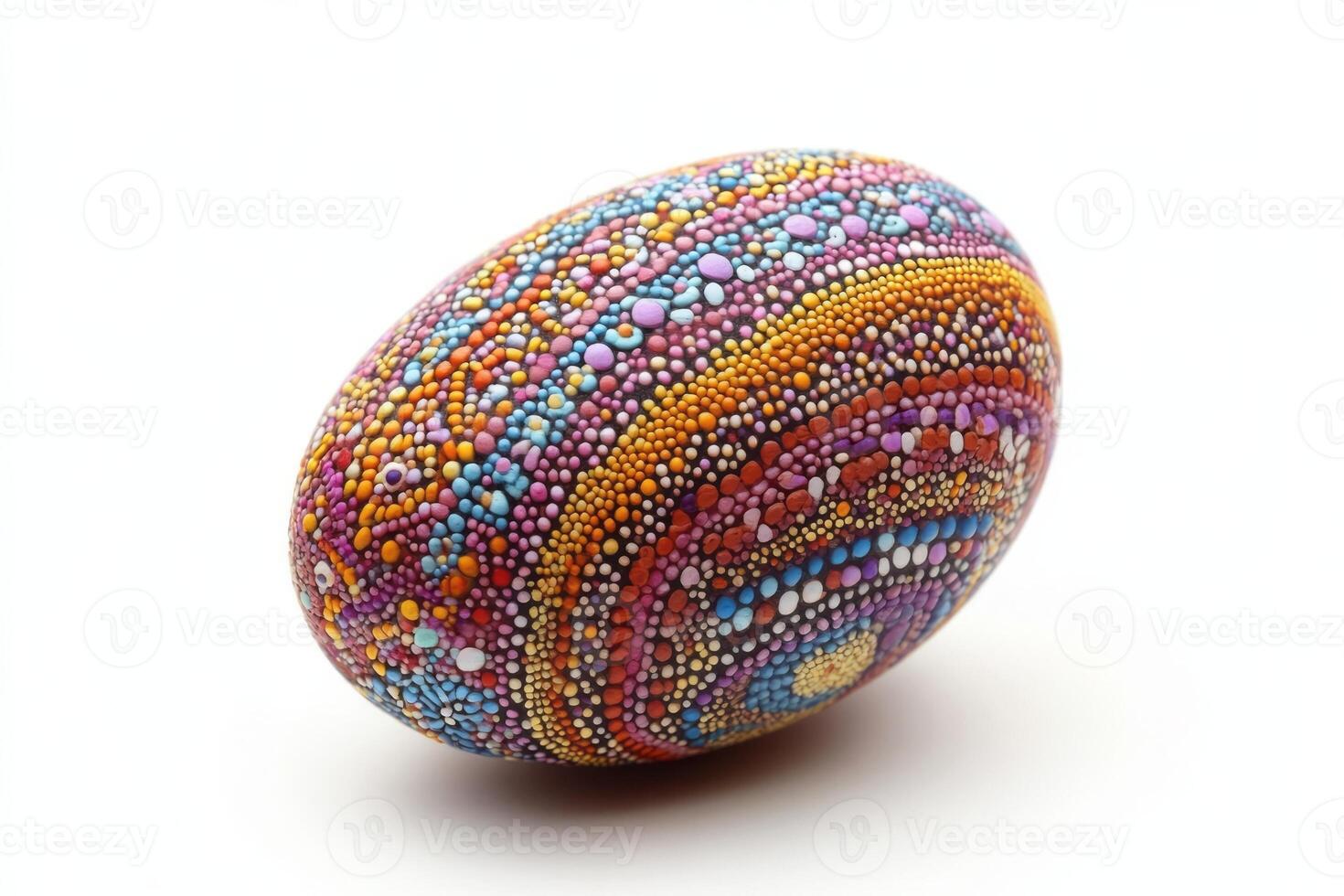 Beautifully crafted decorative egg with vibrant dot patterns in purple, orange, and blue hues. photo