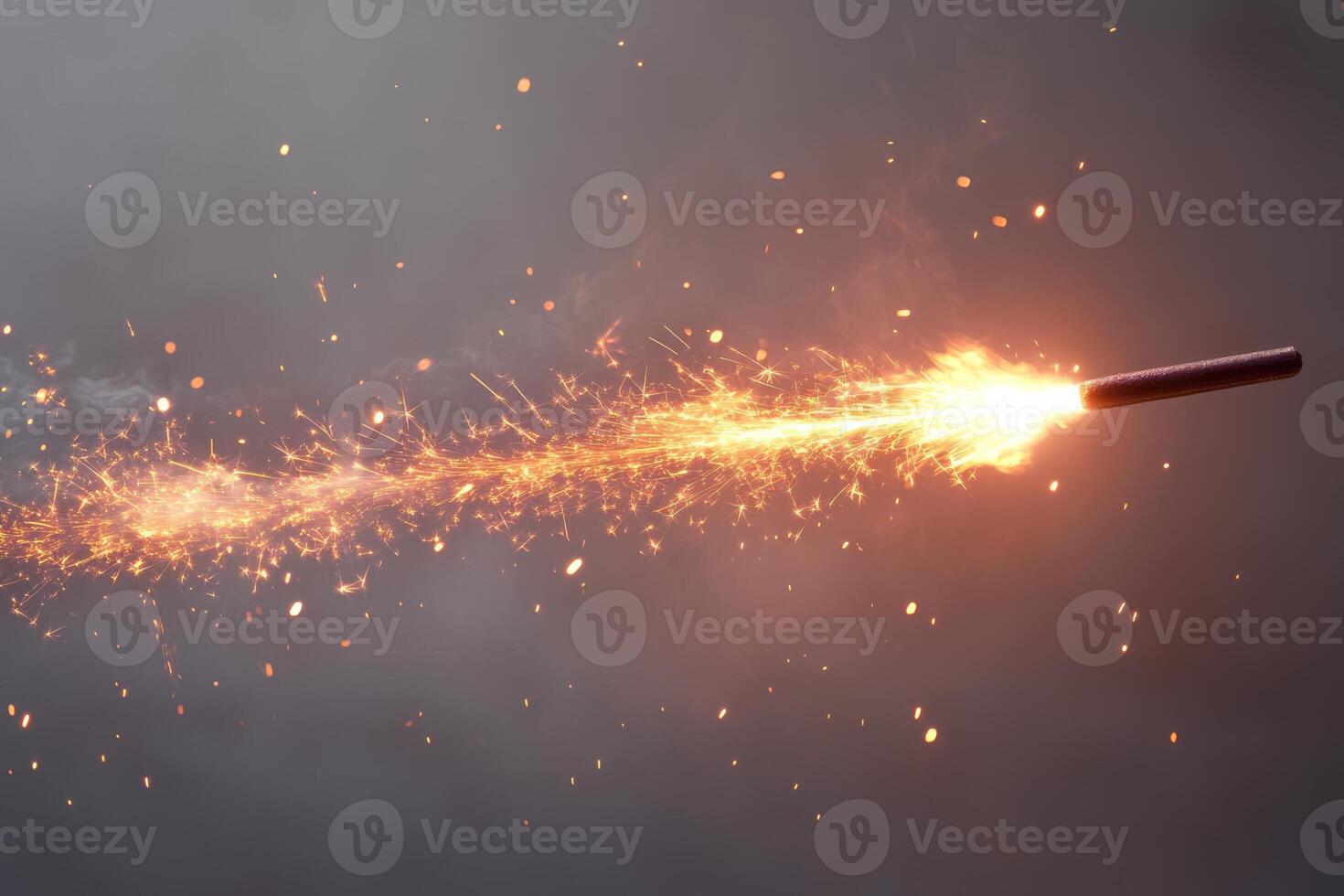 A close-up shot of a sparkler igniting in the darkness, creating a trail of bright sparks and glowing embers. photo
