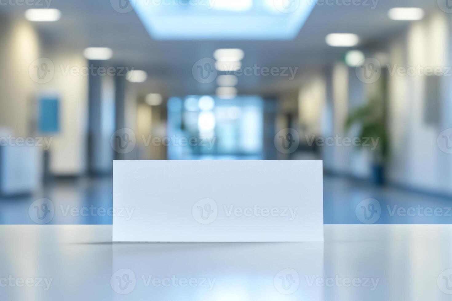 A blank white card sits on a table against a softly blurred office background, creating an atmosphere of professionalism and simplicity. photo