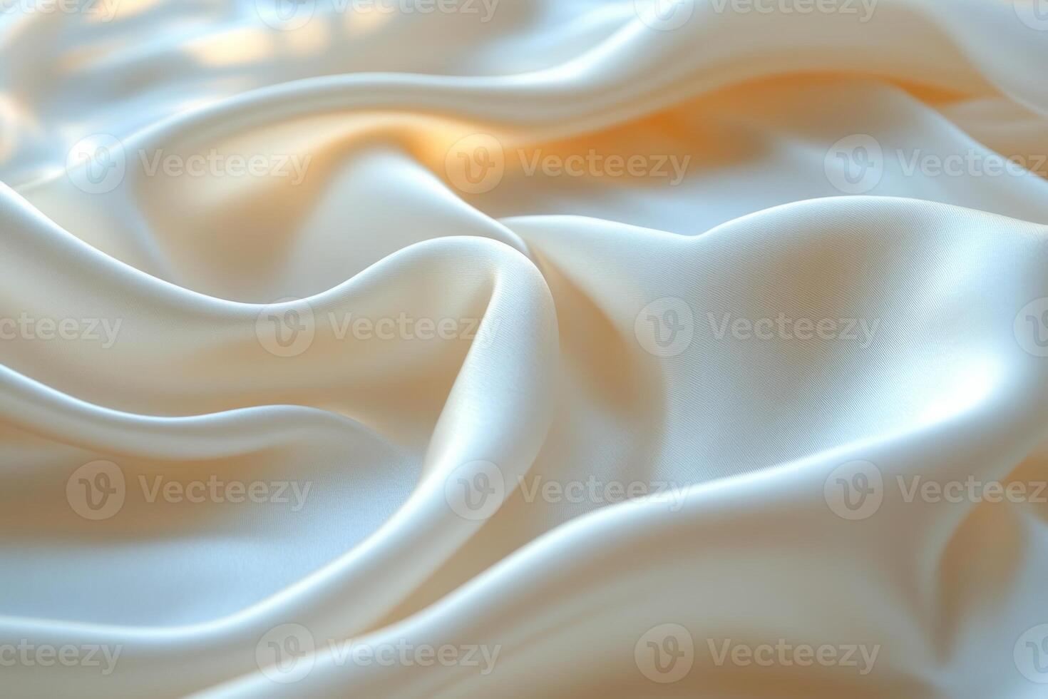 Smooth cream satin fabric creating soft, flowing textures and delicate light reflections. photo