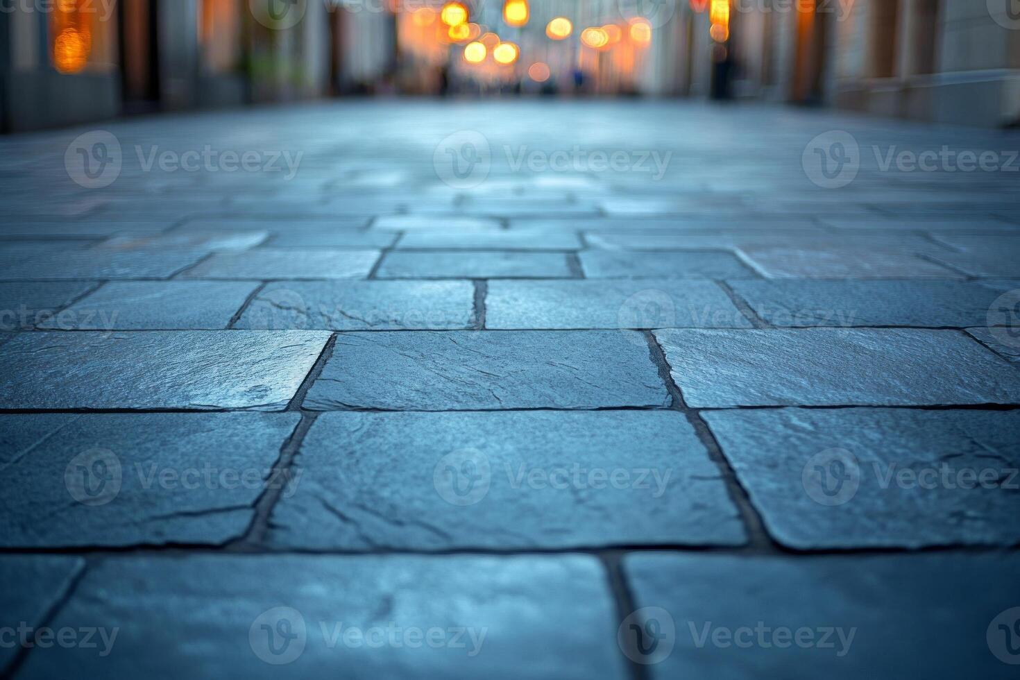 Close-up view of cobblestone pavement in a softly lit alley, creating a tranquil and inviting atmosphere. photo