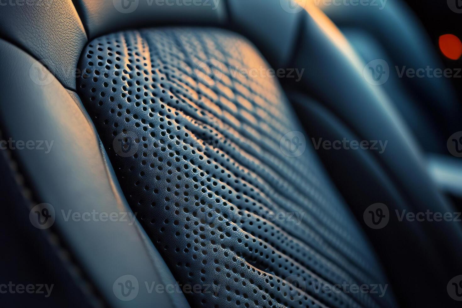 Close-up of a textured leather car seat, showcasing intricate perforations and soft contours. photo