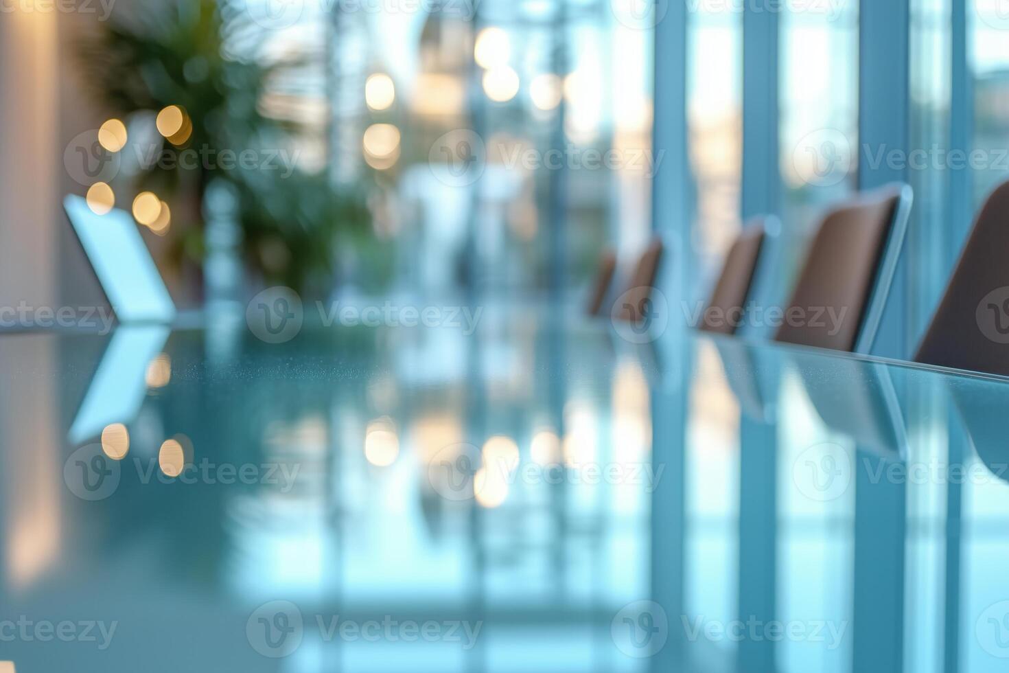 A serene conference room with sleek furniture and a reflective glass table, creating a modern and elegant atmosphere. photo