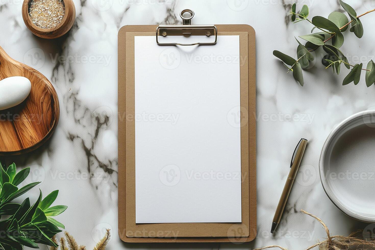 A blank clipboard on a marble surface surrounded by natural elements, perfect for creativity and planning. photo