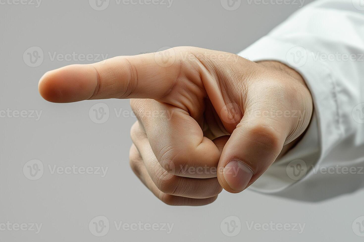 A close-up of a male hand pointing forward, symbolizing direction or emphasis. photo