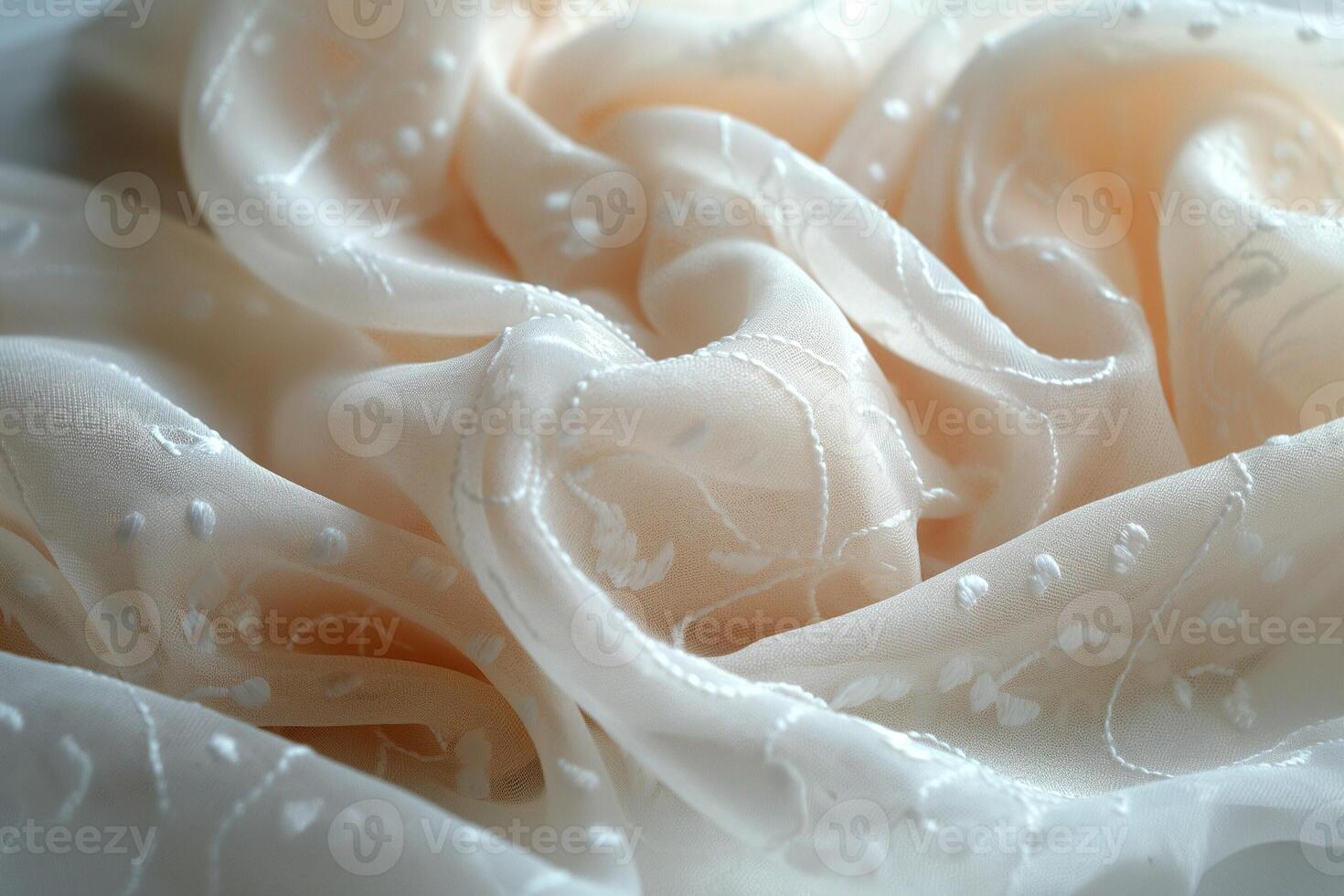 Soft, delicate cream fabric with intricate white embroidery, creating a luxurious texture perfect for fashion or decor. photo