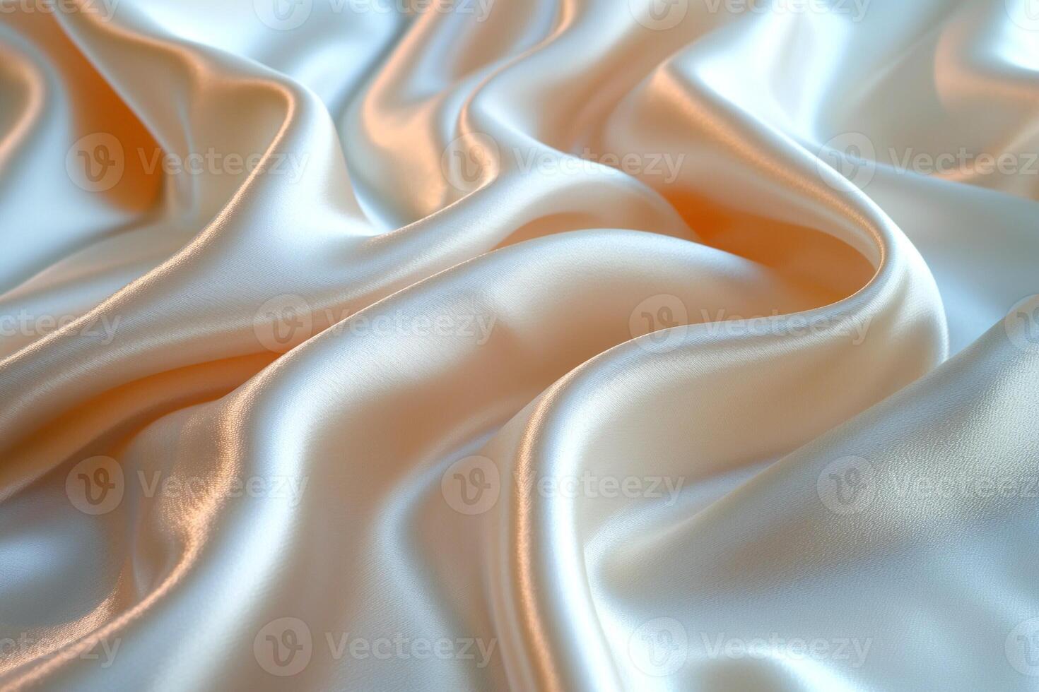 A close-up view of smooth, flowing satin fabric in soft shades of cream and peach. photo