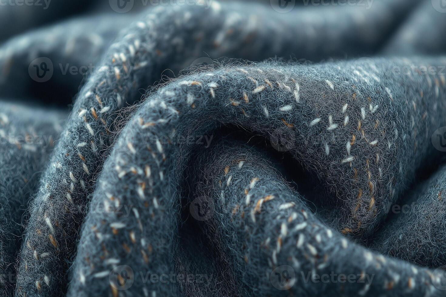 Close-up of a textured wool fabric showcasing intricate stitching details in subtle gray tones. photo