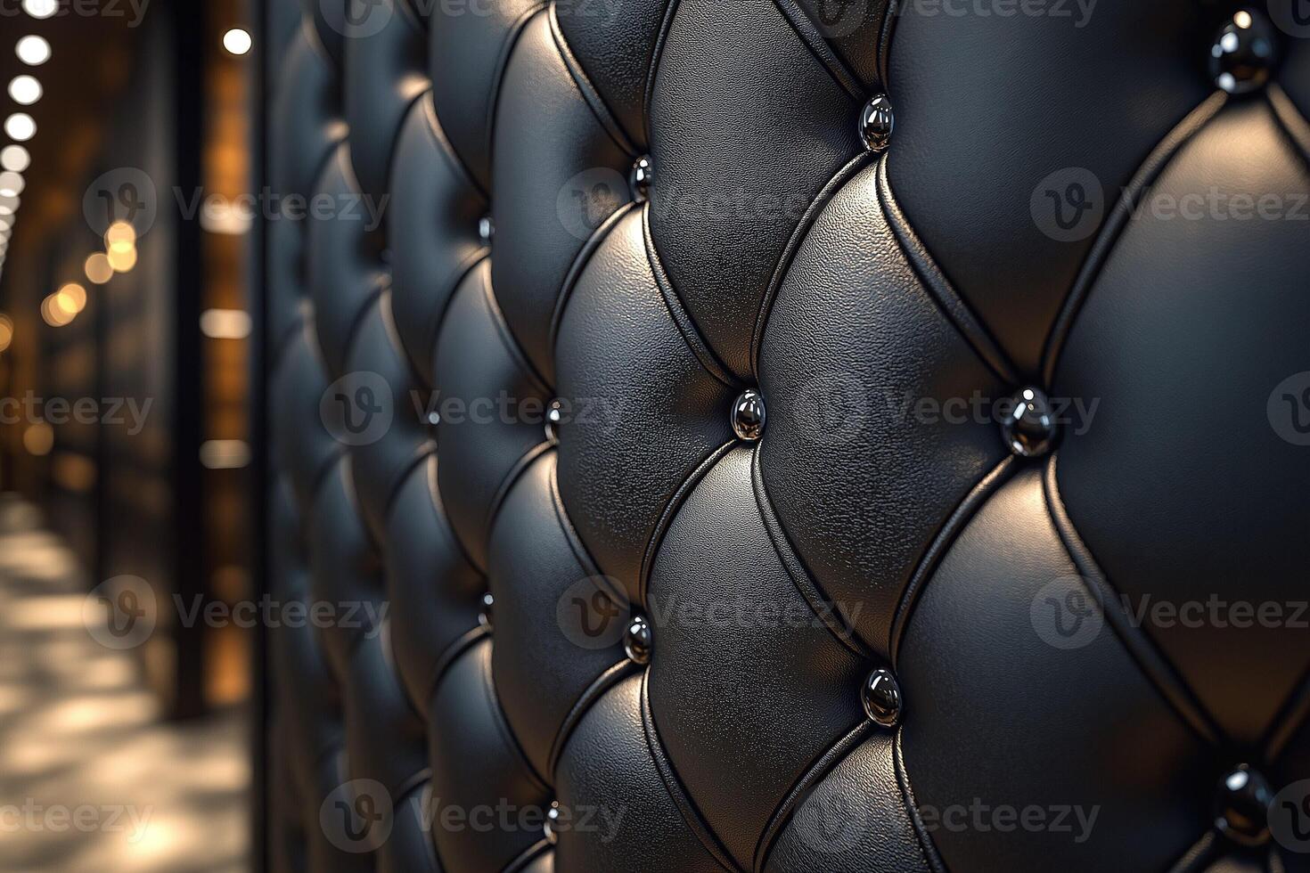Close-up of an elegant black tufted wall, showcasing rich texture and glossy buttons. photo