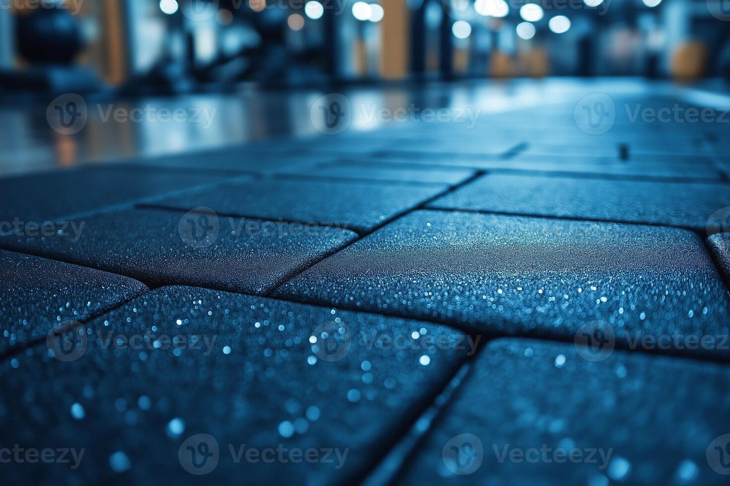 Close-up view of a textured gym floor, showcasing a sleek and modern fitness environment. photo