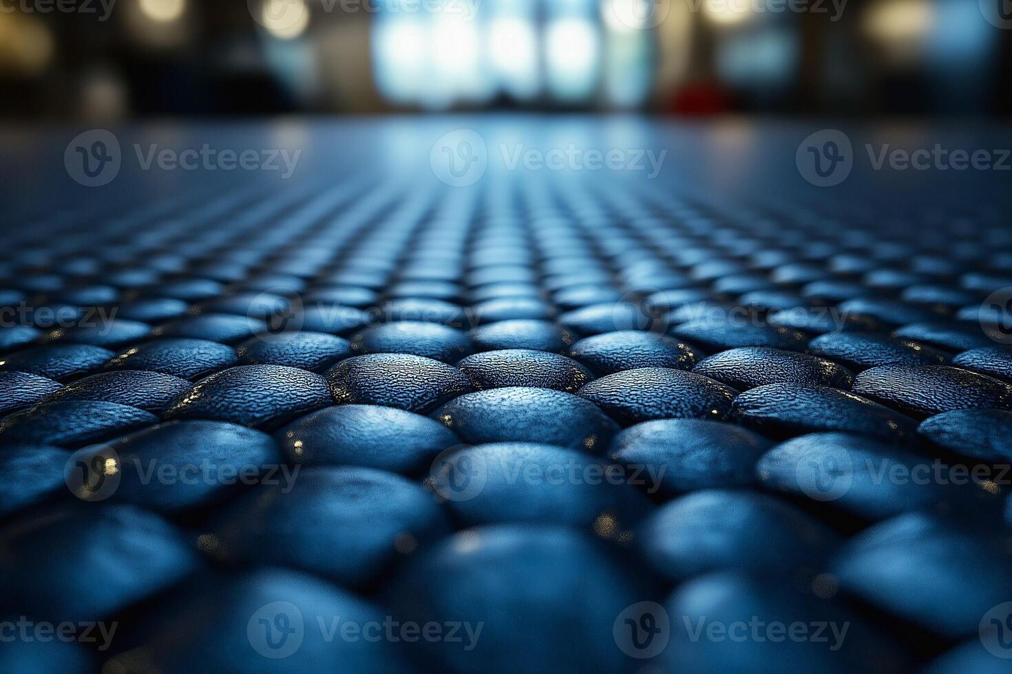 Close-up of a textured blue surface with raised circular patterns, creating a modern and artistic ambiance. photo