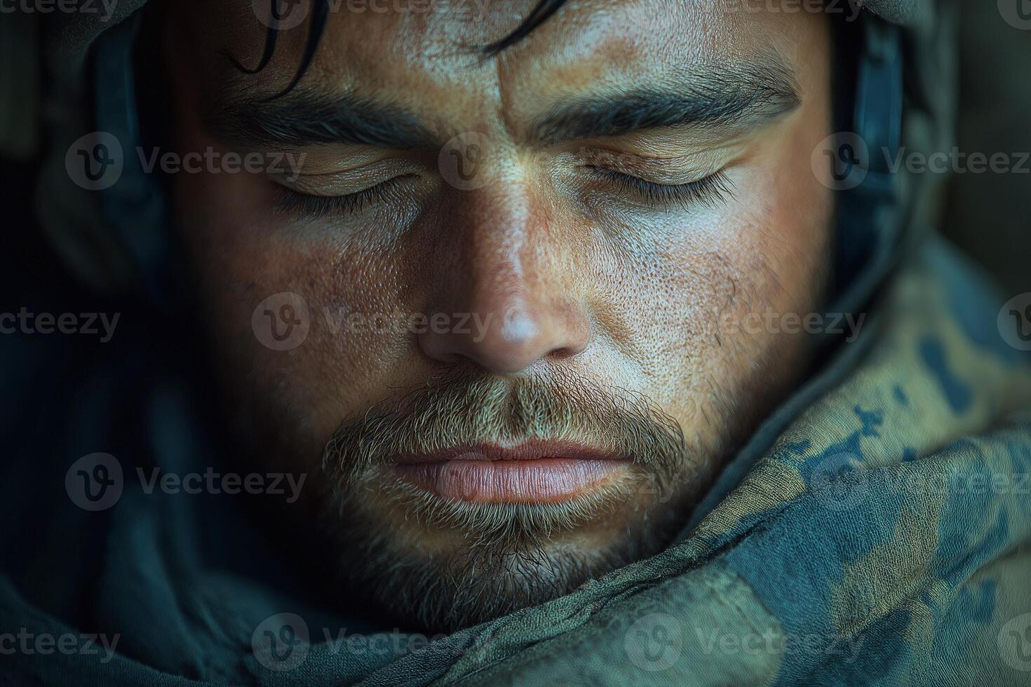 Portrait of a tired soldier resting with closed eyes, showcasing resilience and determination. photo