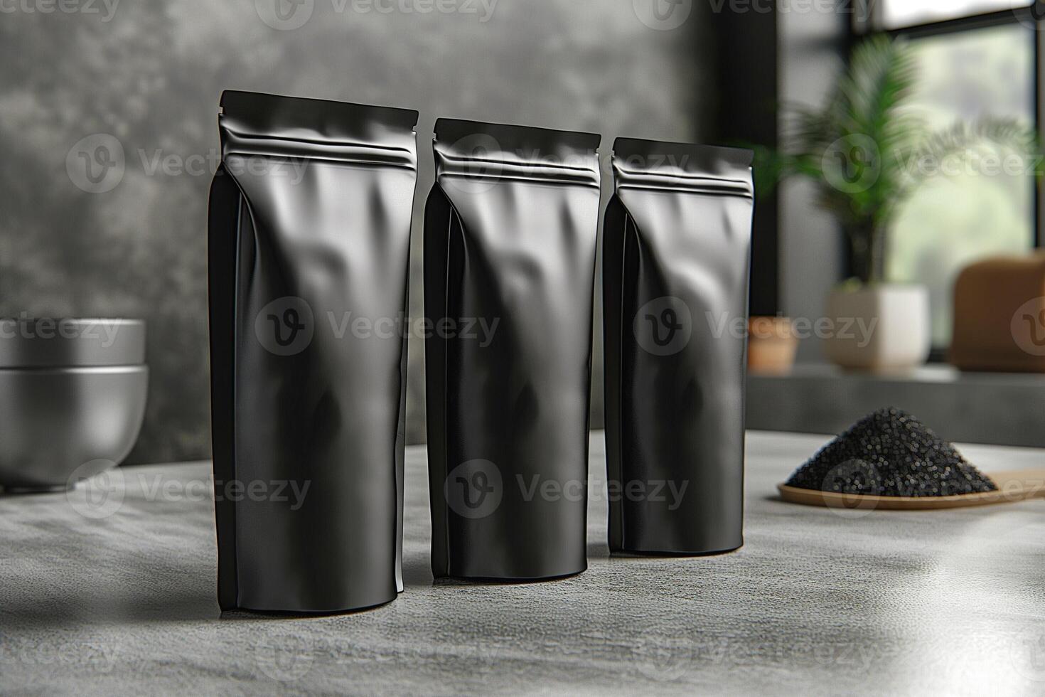 Three sleek black packaging bags lined up on a modern countertop, creating a minimalist aesthetic. photo