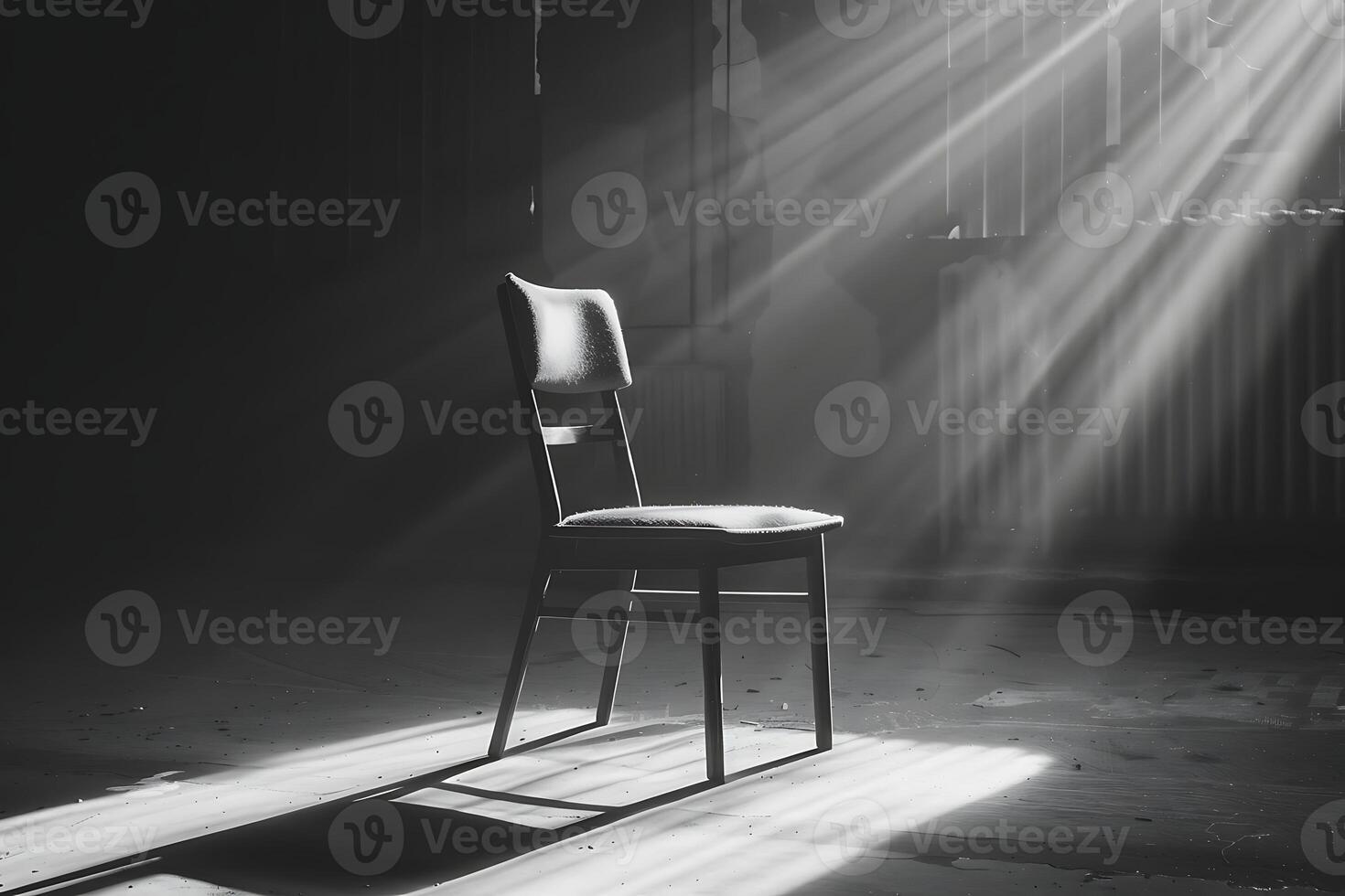 A chair sits in the sun in an empty room photo