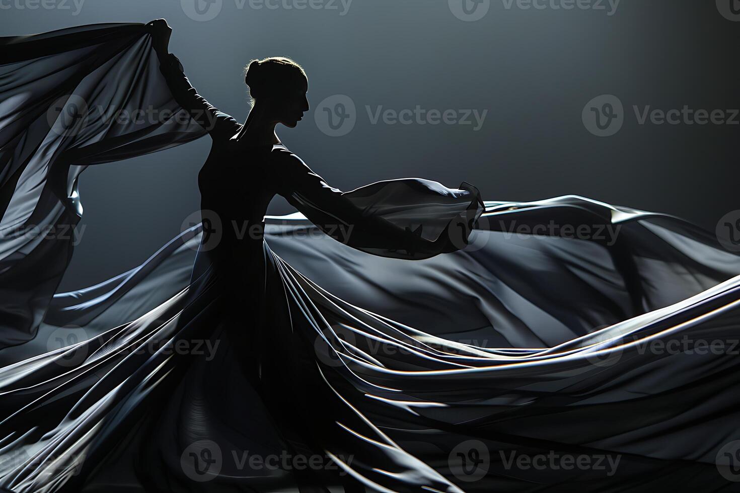 A woman in a black dress is dancing in the dark photo