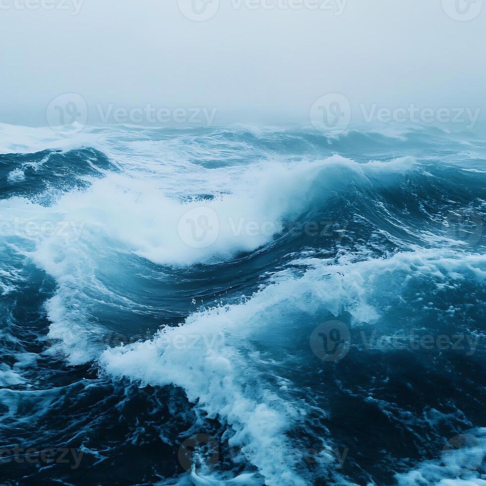 A large ocean wave with a dark sky photo