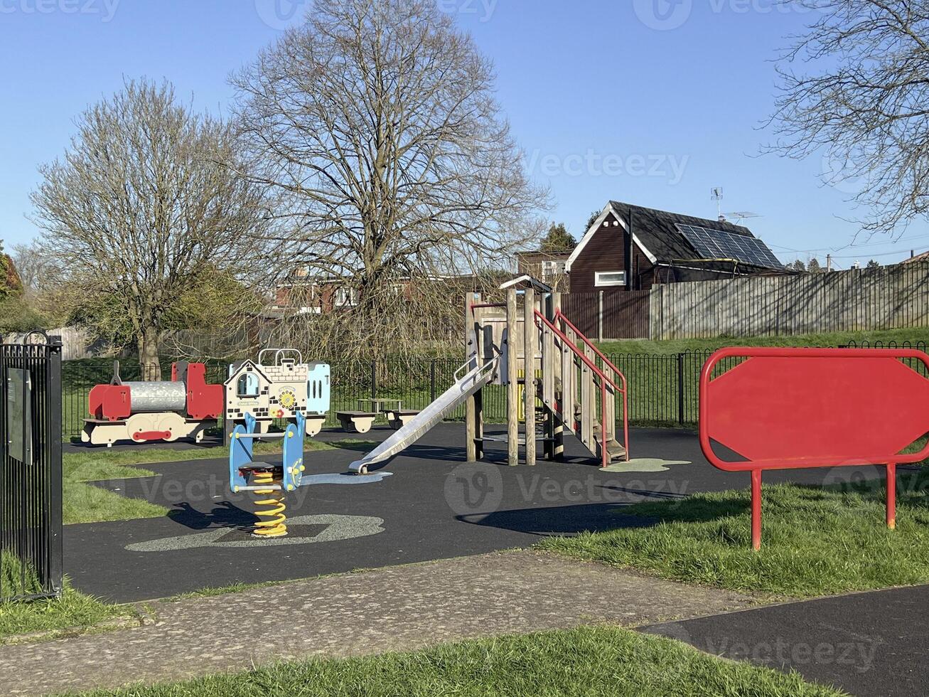 playground with a slide in a park for children photo