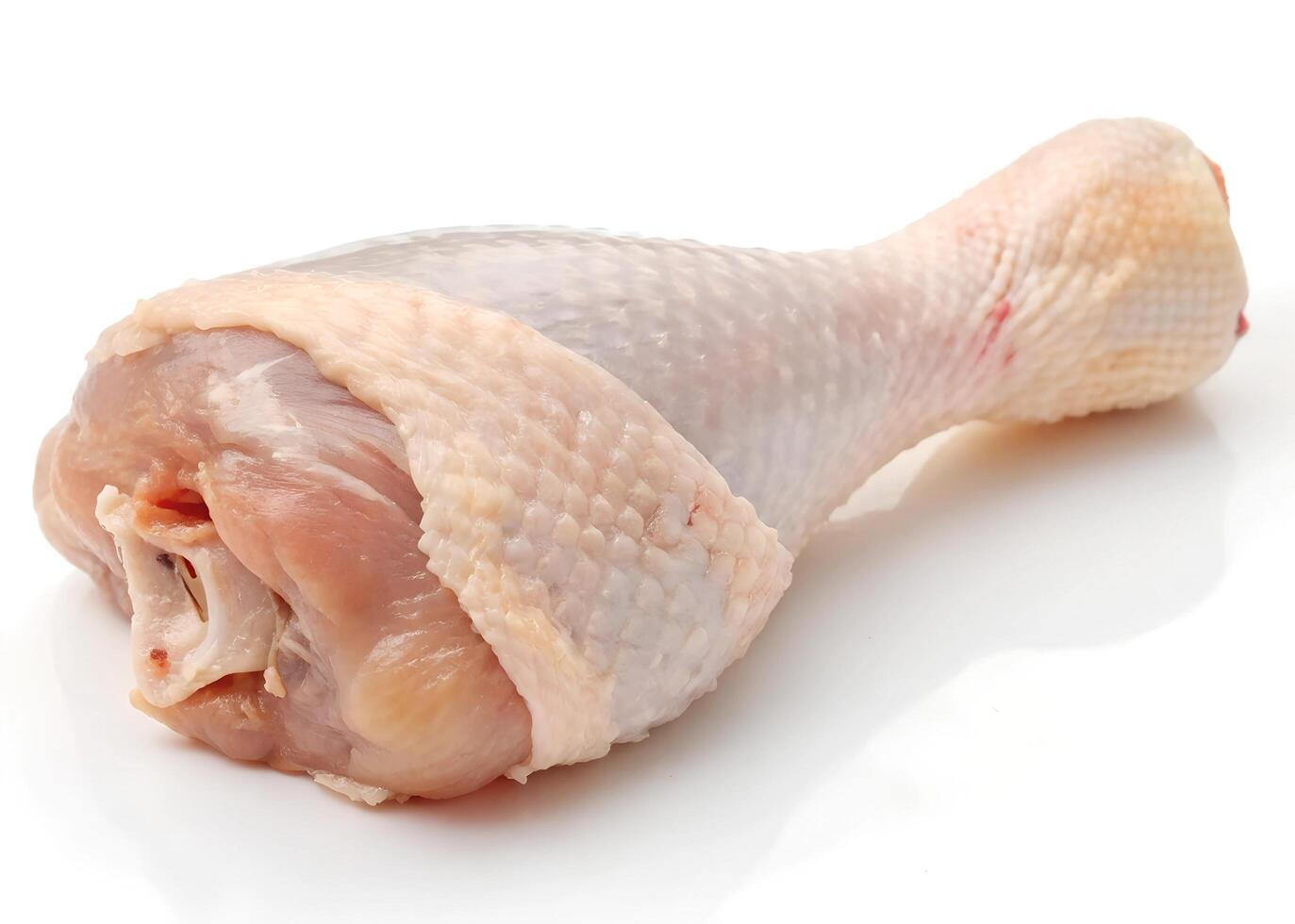 Raw chicken drumsticks, isolated on white photo