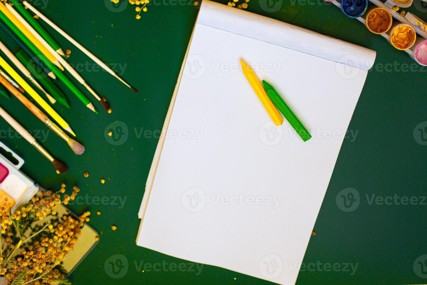 blank paper and colored pencils photo