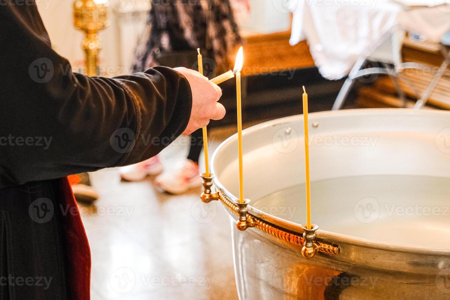 The details chriistening ceremony in the church candles photo