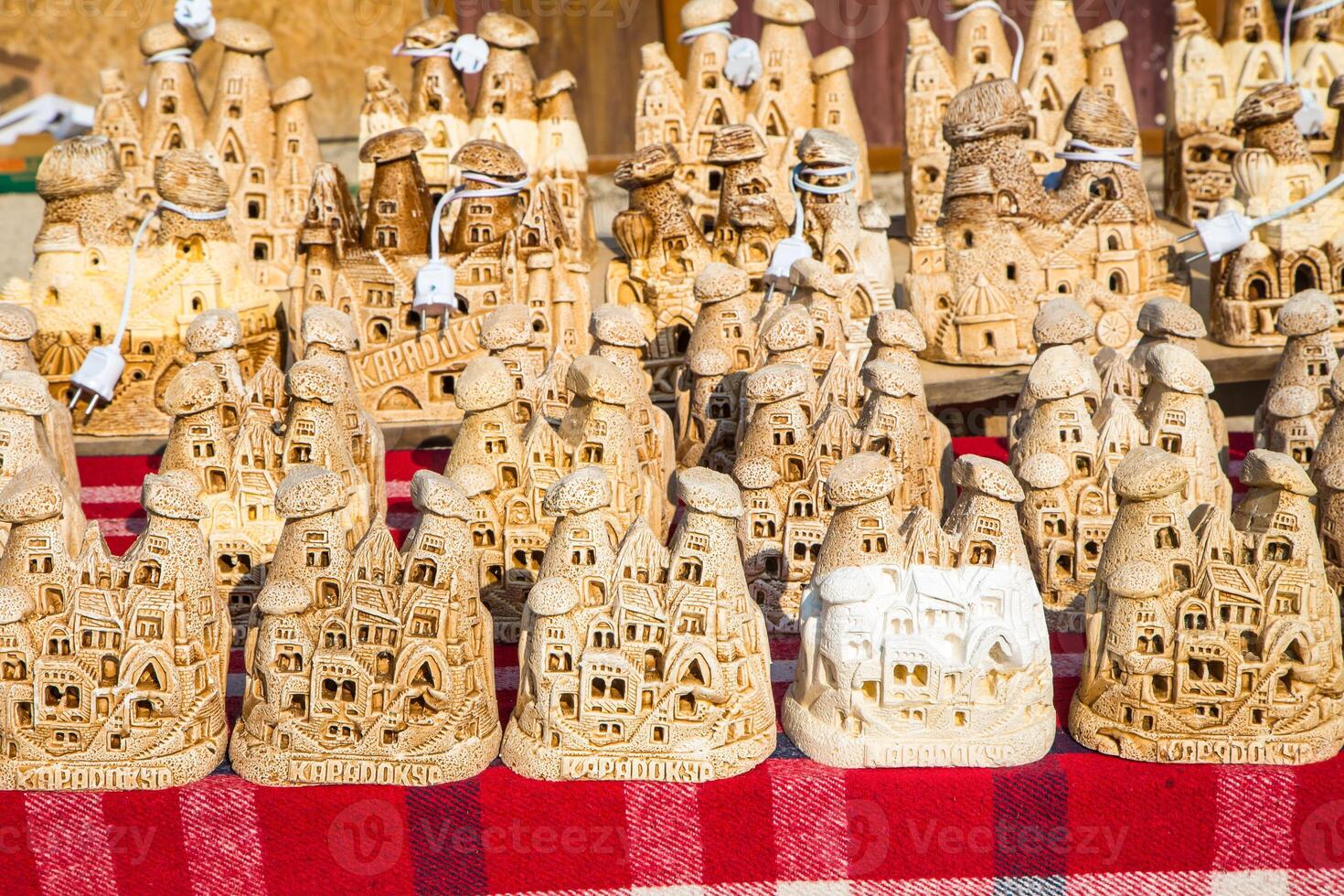 A table with many carved wooden houses photo