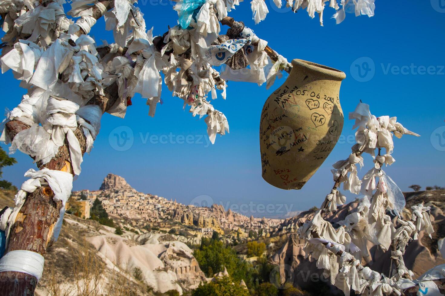 A vase with white paper on it photo