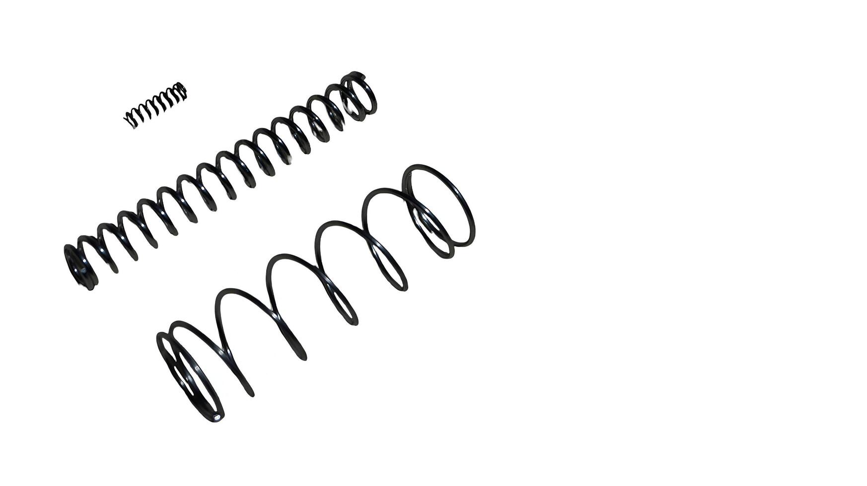 Coiled metallic springs offering flexible resilience and support system photo