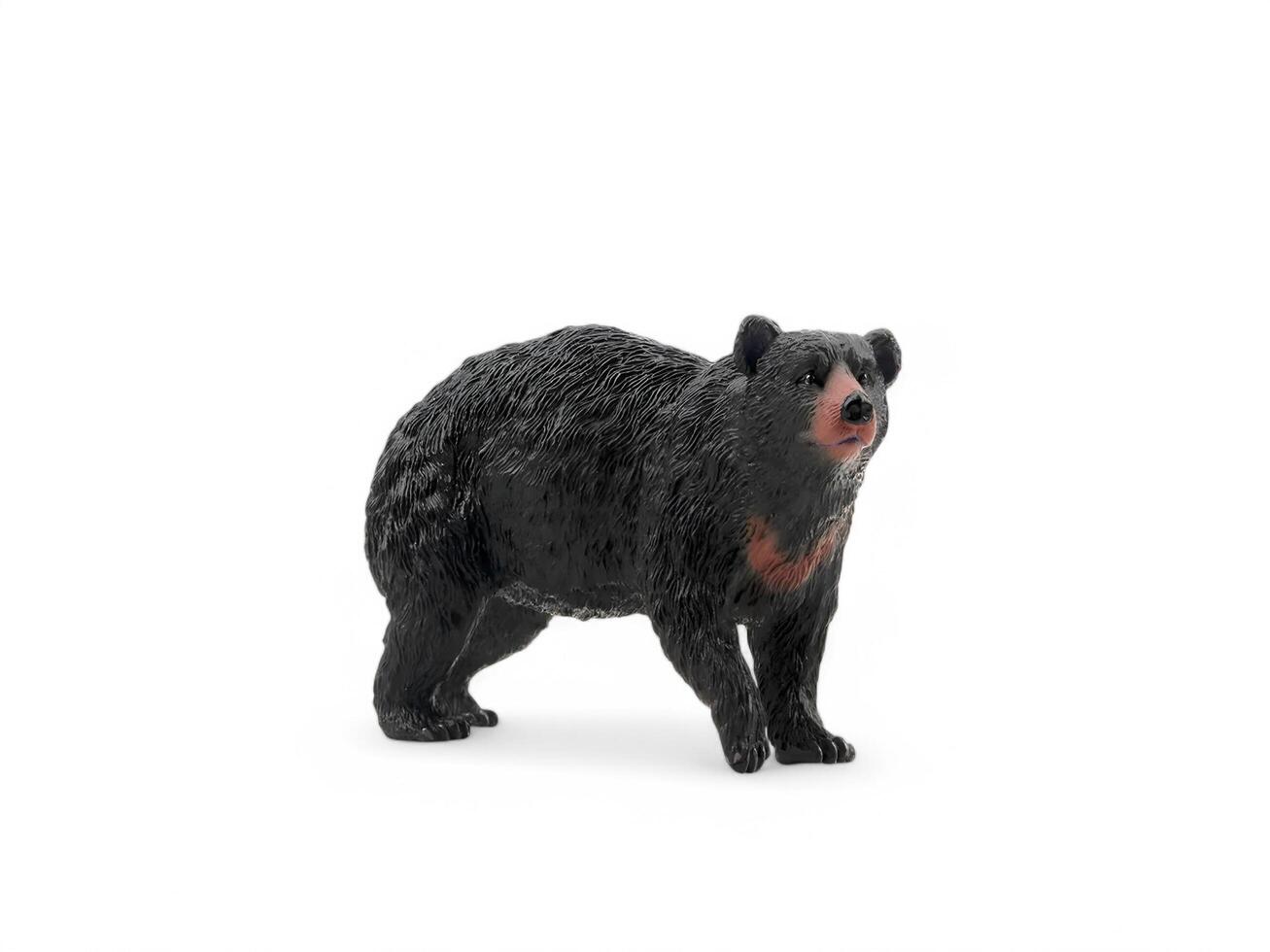 A black bear figurine on a white background photo