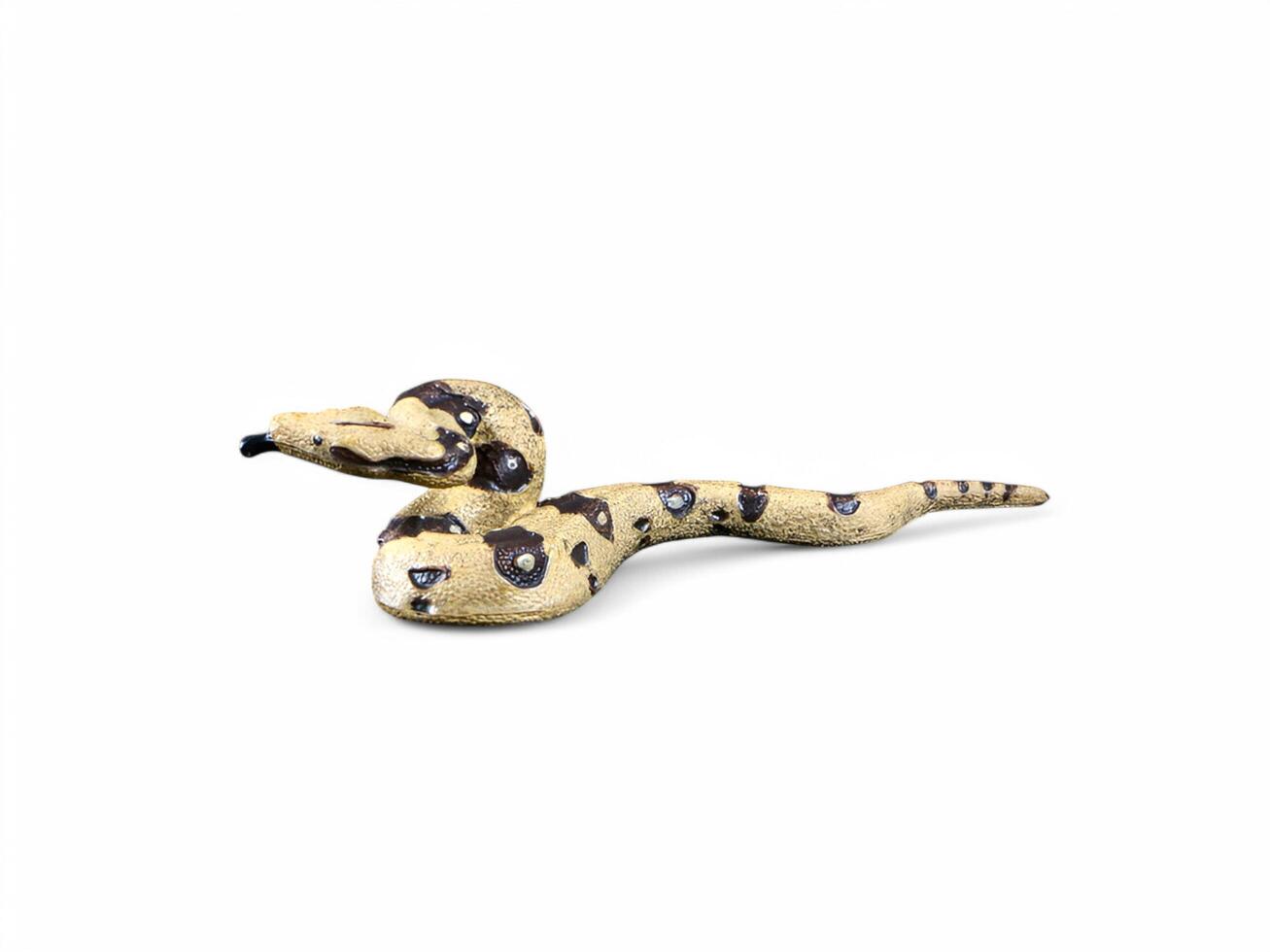 A snake figurine with a black and white pattern photo