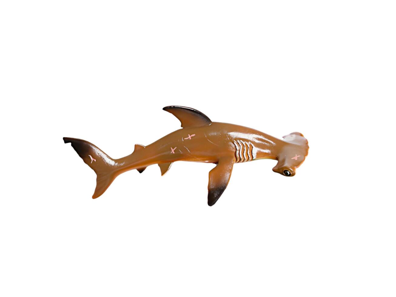 A plastic hammershead shark with a long tail photo