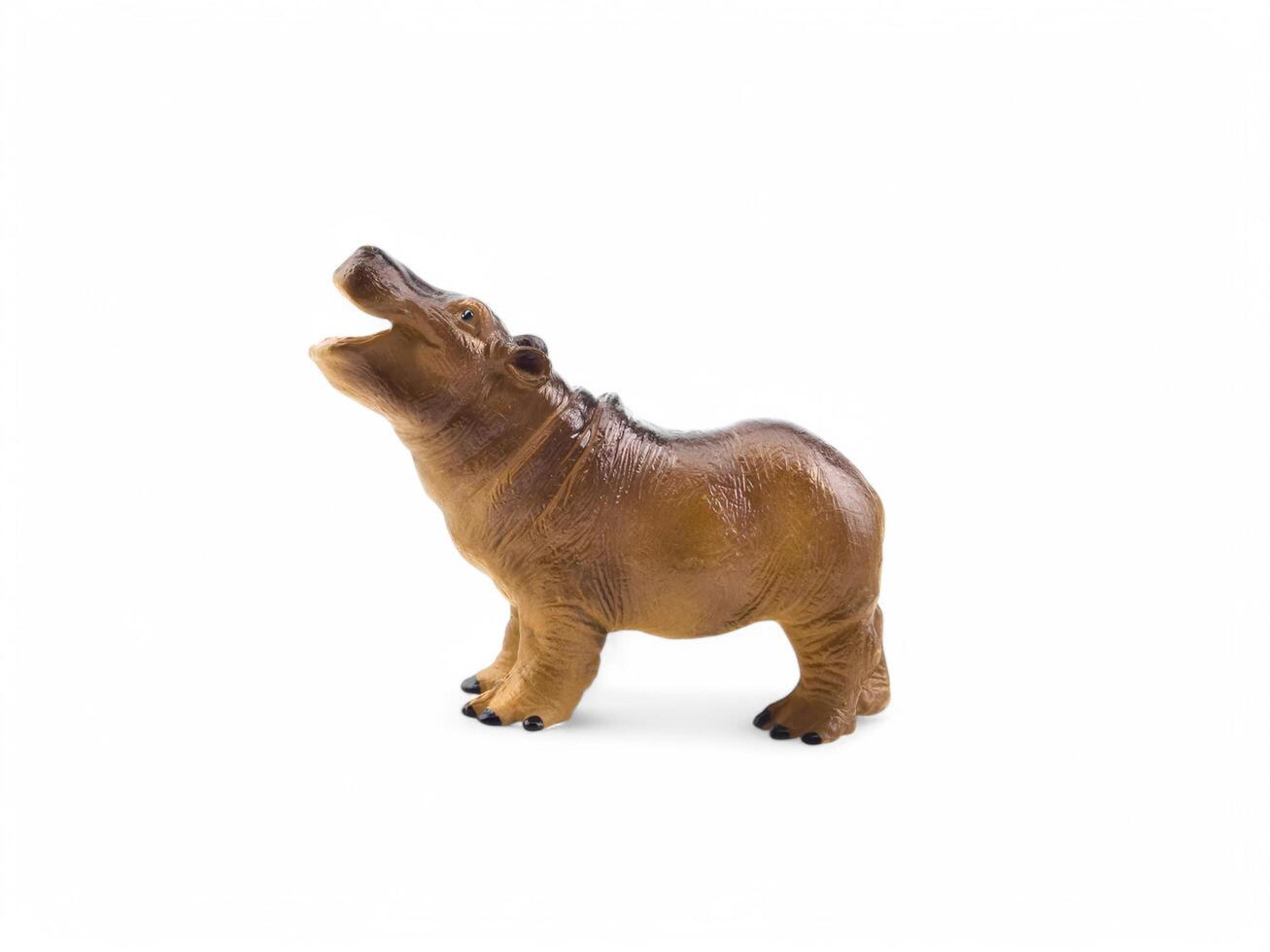 A toy hippo standing on its hind legs photo