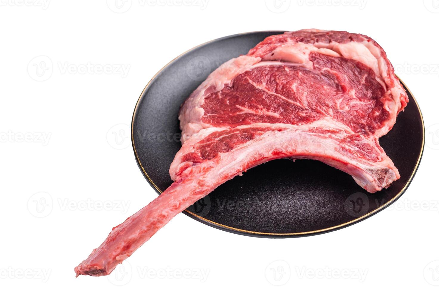 Fresh Tomahawk beef steak, raw marbled rib eye with bone on plate with herbs Isolated on a white background. top view photo