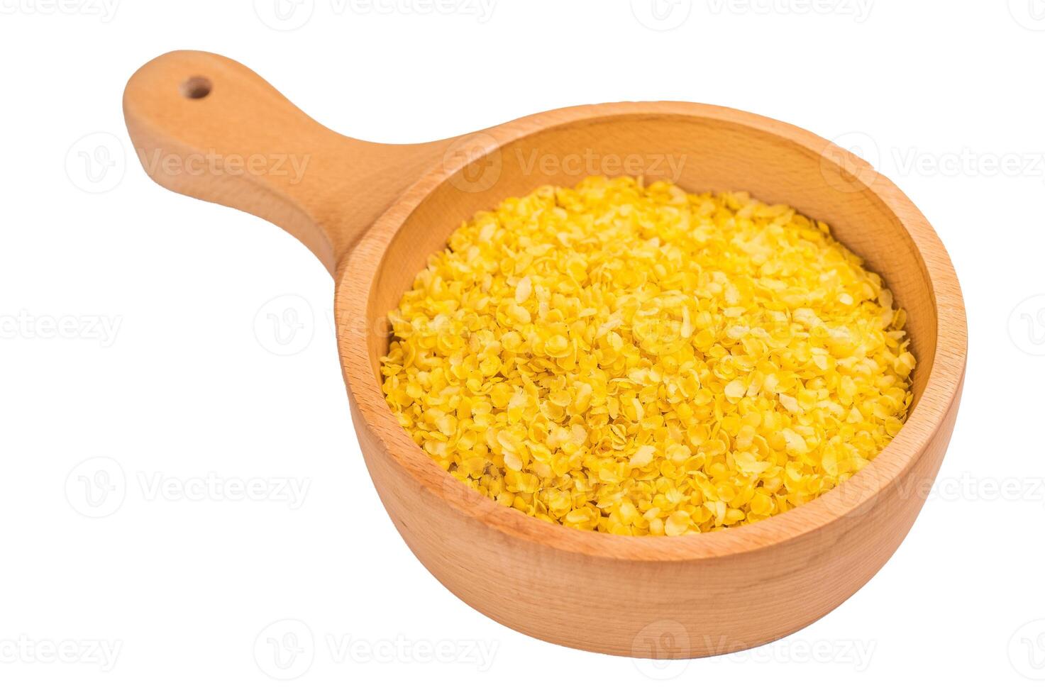 Healthy raw dry Millet flakes for porridge and muesli isolated on white background. top view photo