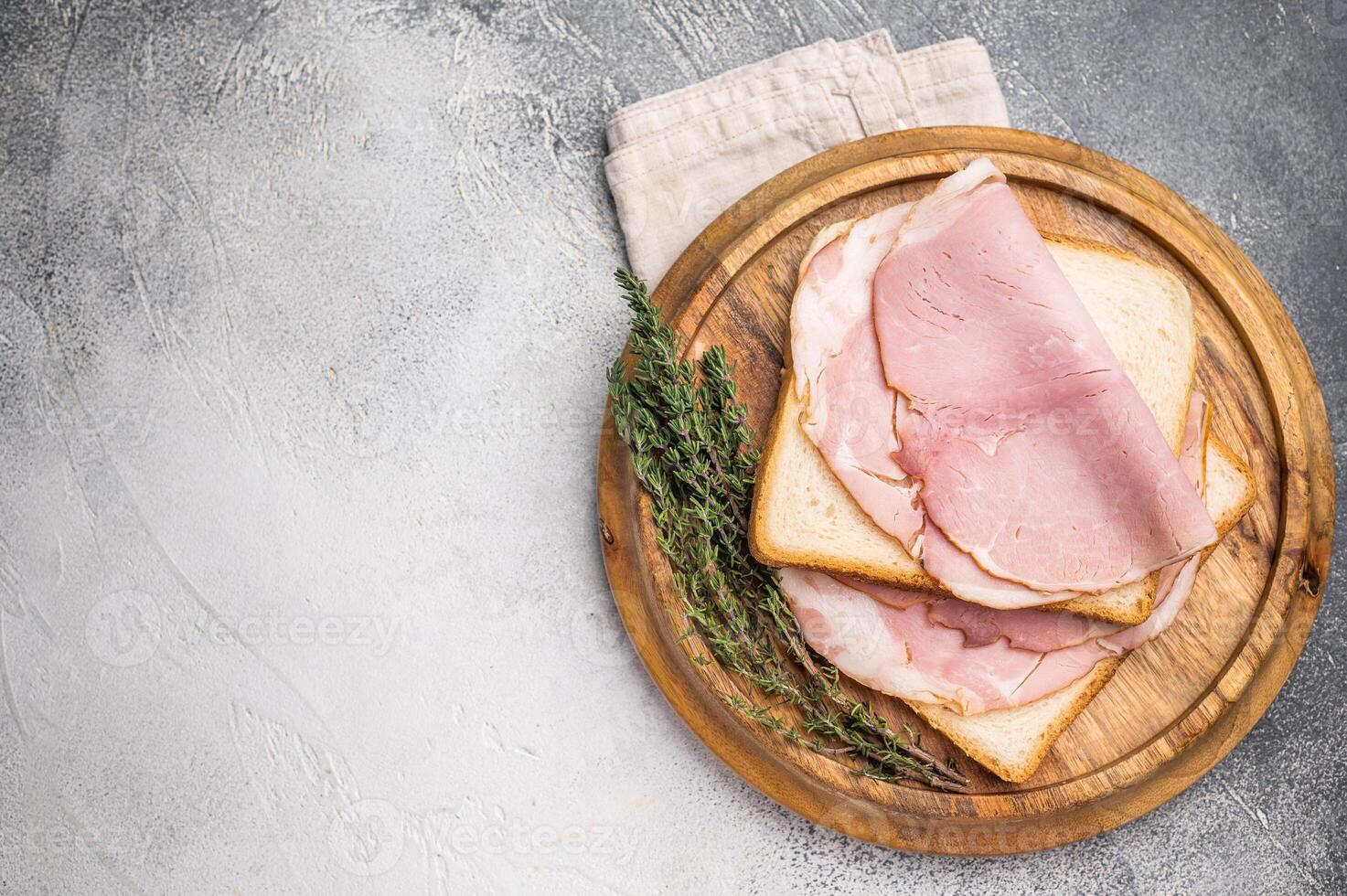Ham sandwich, Bread with sliced pork meat. grey background. top view photo
