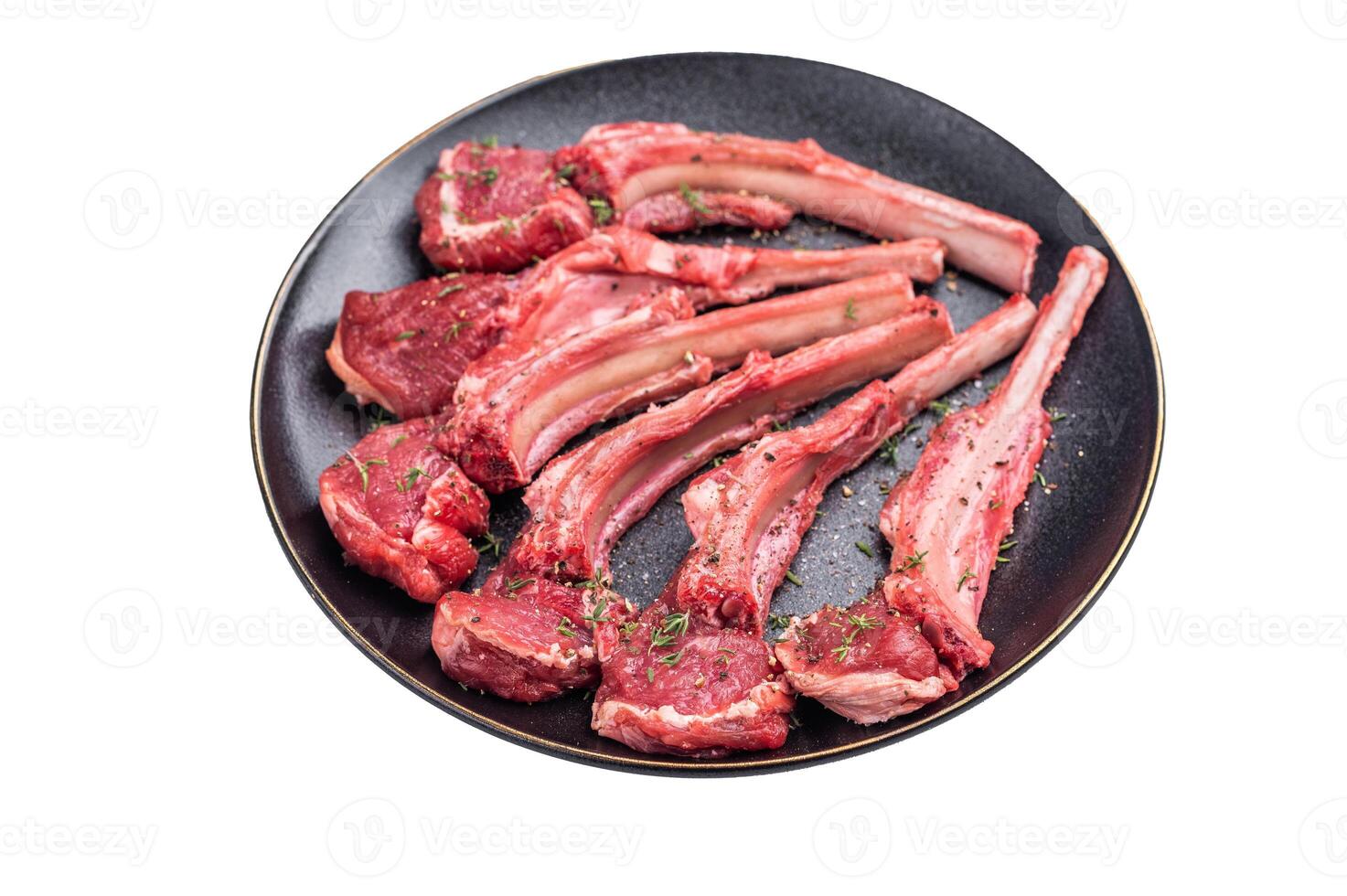 Fresh mutton chops, raw lamb meat cutlets on a plate isolated on white background. top view photo
