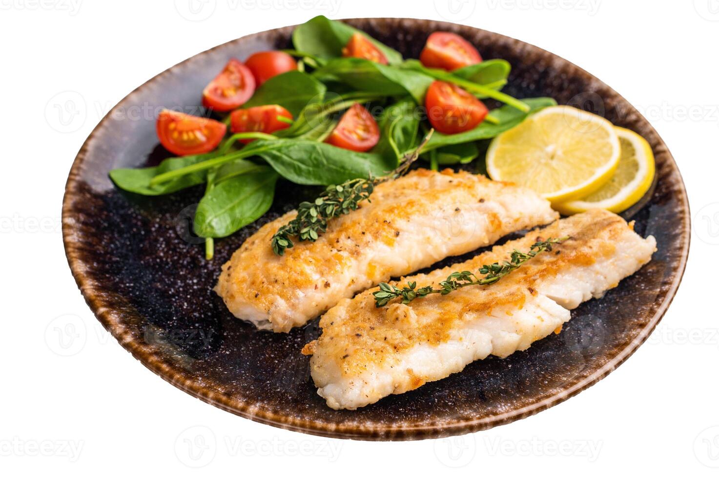 Roast Cod fish fiilets, white fish meat on plate with salad isolated on white background photo