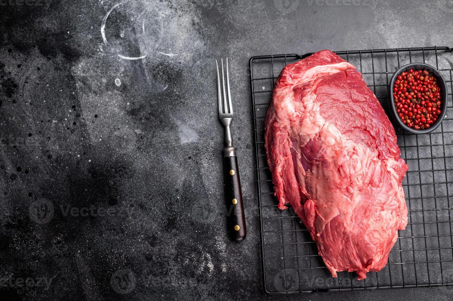 Close-up of raw boneless beef shank cuts, highlighting their tender texture and vibrant hue, ideal for culinary enthusiasts seeking quality ingredients. black background. top view photo