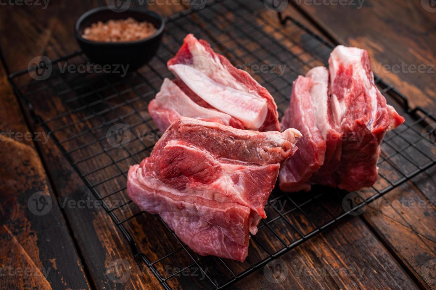 Thick Cut raw lamb Short Ribs, fresh mutton meat with bone. wooden background. top view photo