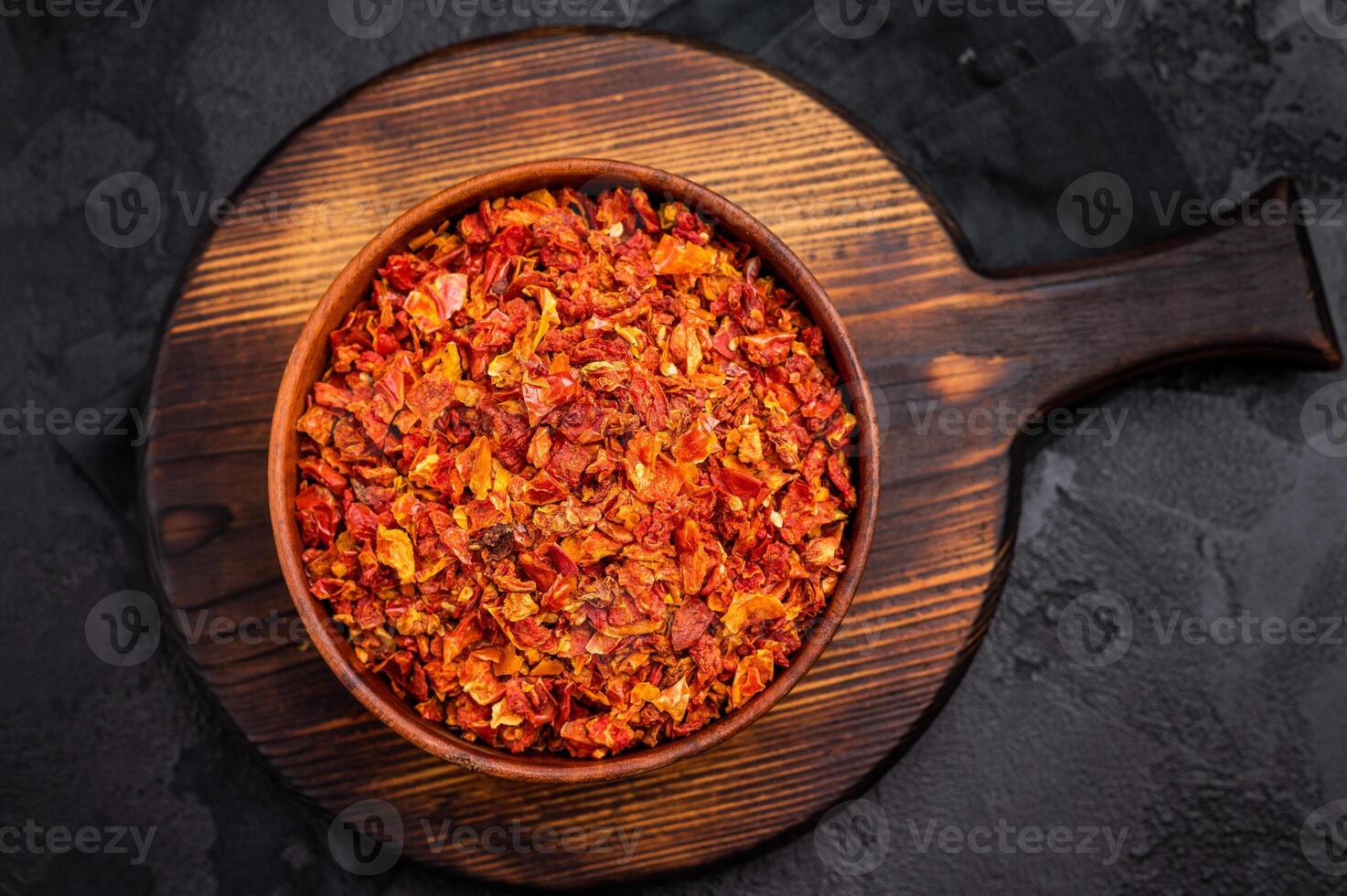 Dried and chopped Tomato for cooking. black background. top view photo