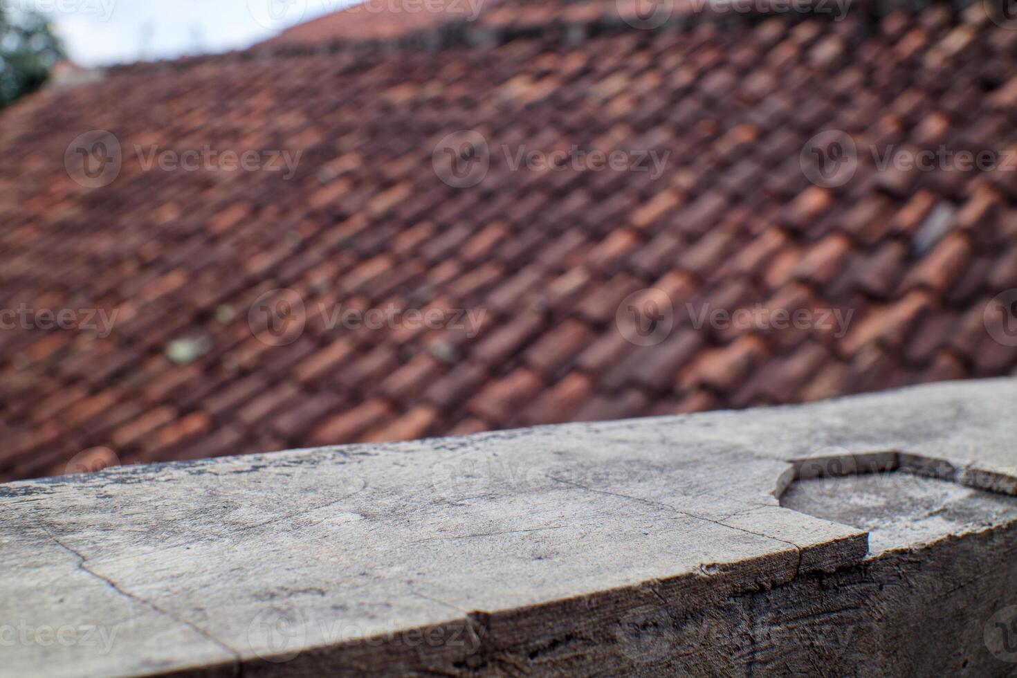 Blurred Roof Tiles with Concrete Surface Texture in Focus photo