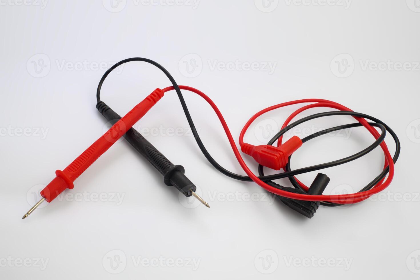 Multimeter Test Probes with Red and Black Wires on White Background photo