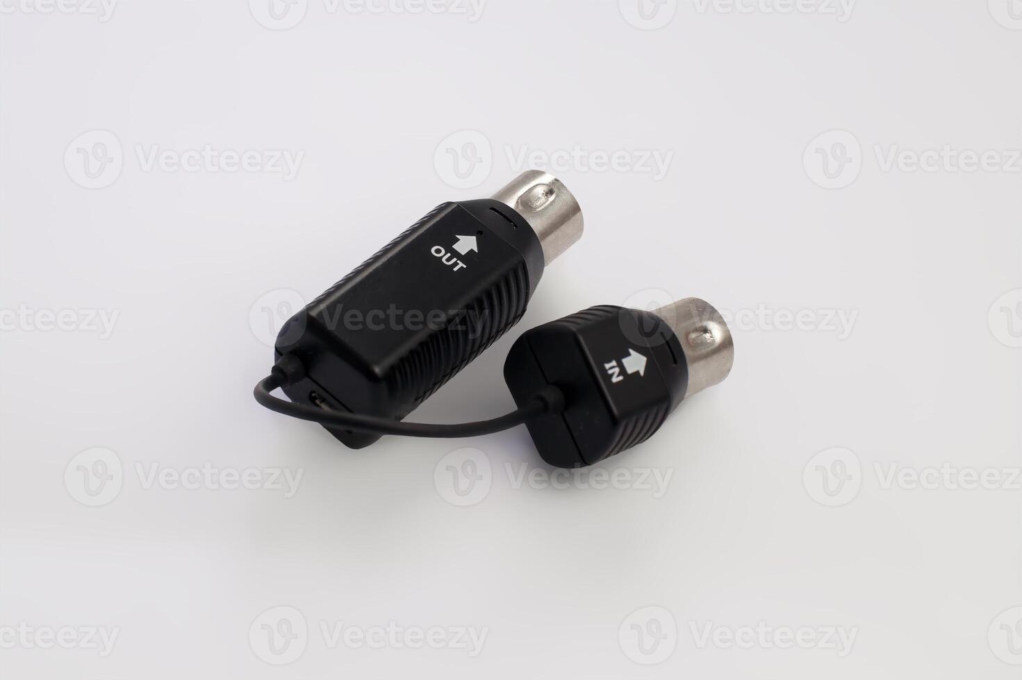 Close-Up of MIDI Cable Connectors with IN and OUT Labels on White Background photo