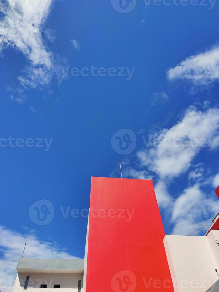 Red buildings against a contrasting blue sky background photo